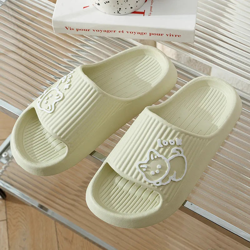 Women's green cat slippers with thick EVA platform sole on a wooden floor