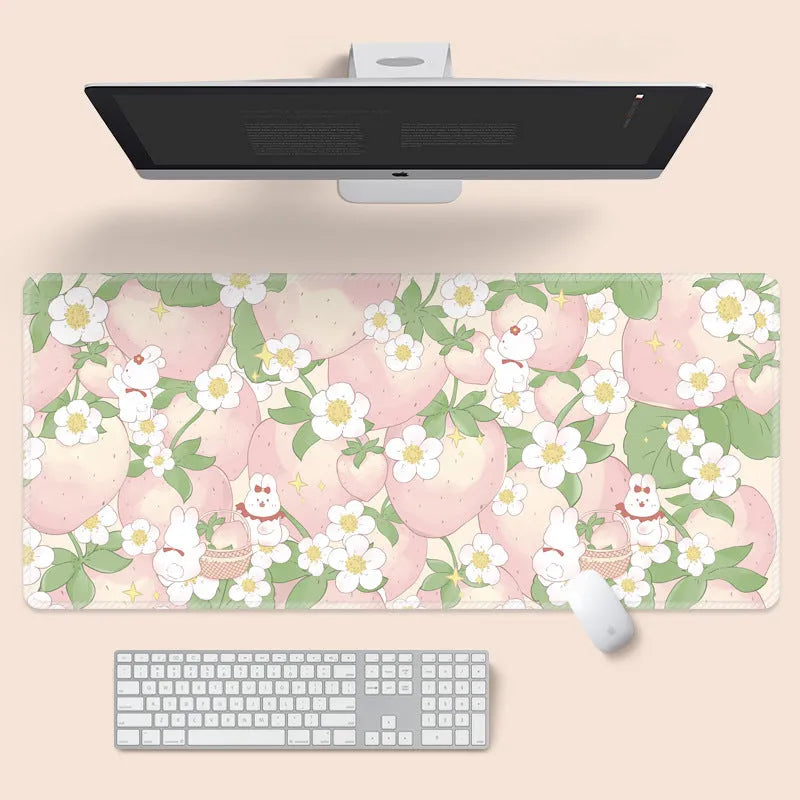 Large floral pattern mouse pad on a desk, showing non-slip rubber base and thin cloth surface.