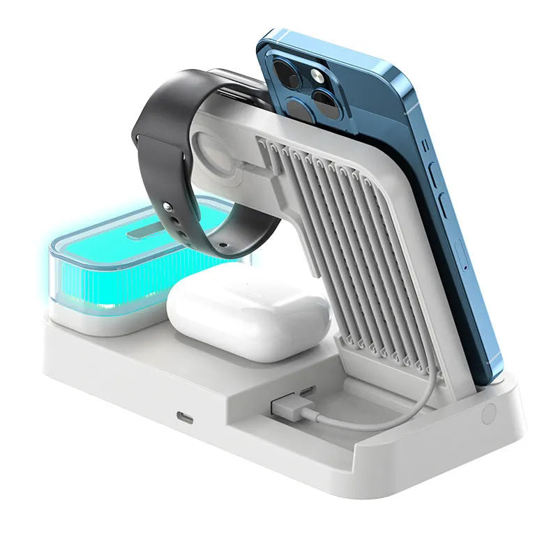 White 4-in-1 foldable wireless charging station showing phone charging on stand, with alarm clock display and RGB night light glow.