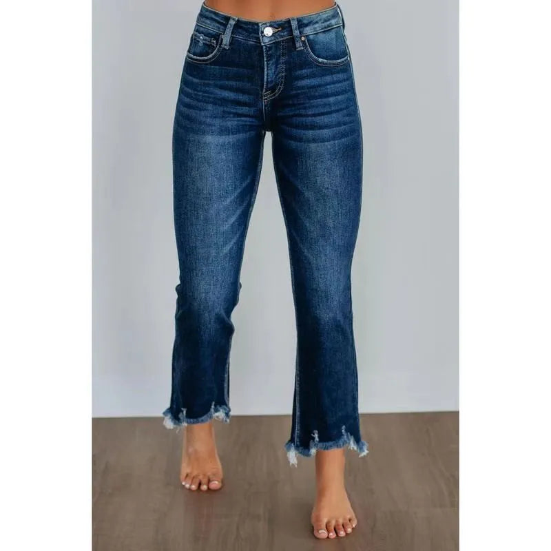 Women's solid blue denim trousers with a casual, hand-worn finish on a hanger.