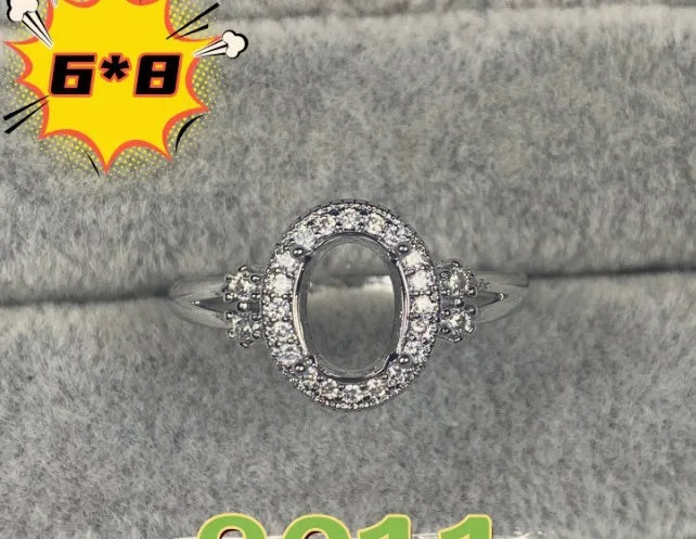 Oval denier ring ornament with 6x8mm stone, open mouth design, and five-pointed star detail
