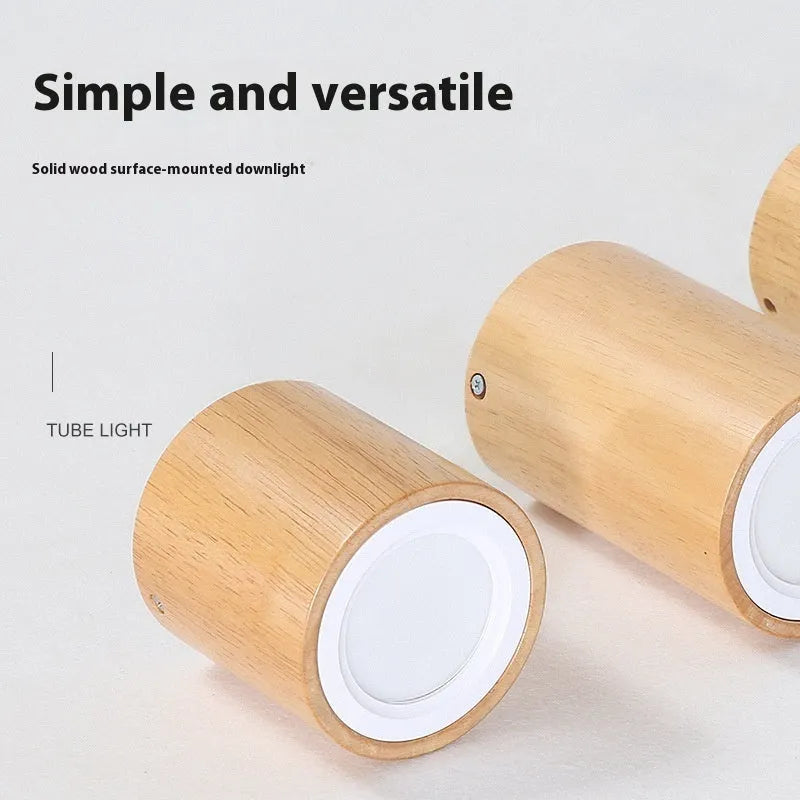Modern solid wood surface mounted downlight in wood colour, shown in round and square designs for corridor or entrance ceilings.