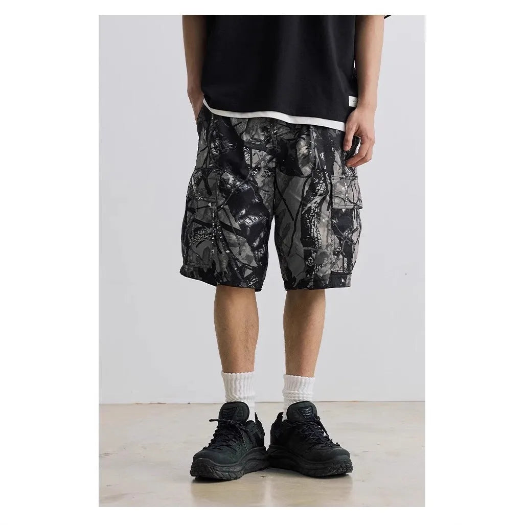 Man wearing loose straight-leg denim shorts with an elastic waistband in army green colour.