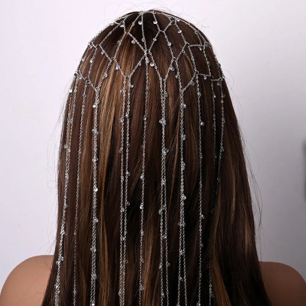 Gold rhinestone headband with dangling tassel mesh for formal hairstyles.
