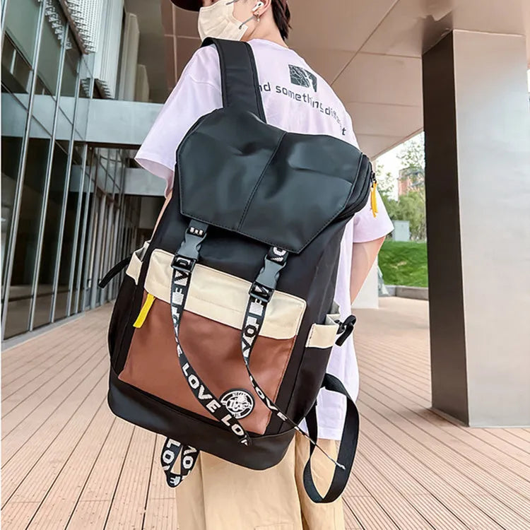 Oxford cloth school backpack showing three carrying methods with 32cm width dimensions