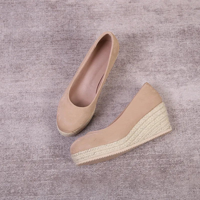 Women's apricot wedge heel pumps with rope-textured sole and shallow mouth opening on a white background.