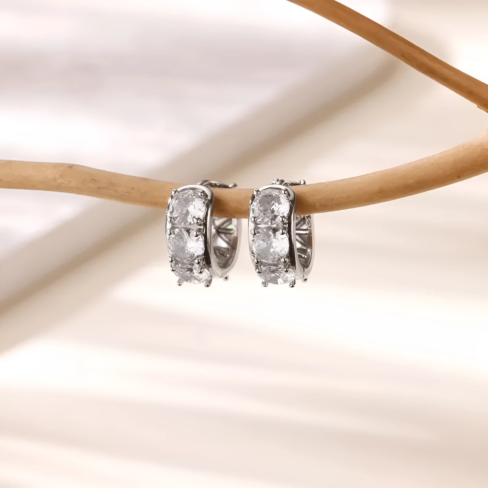 Stainless steel U-shaped clip earrings with inlaid zircon accents in colour E5772P