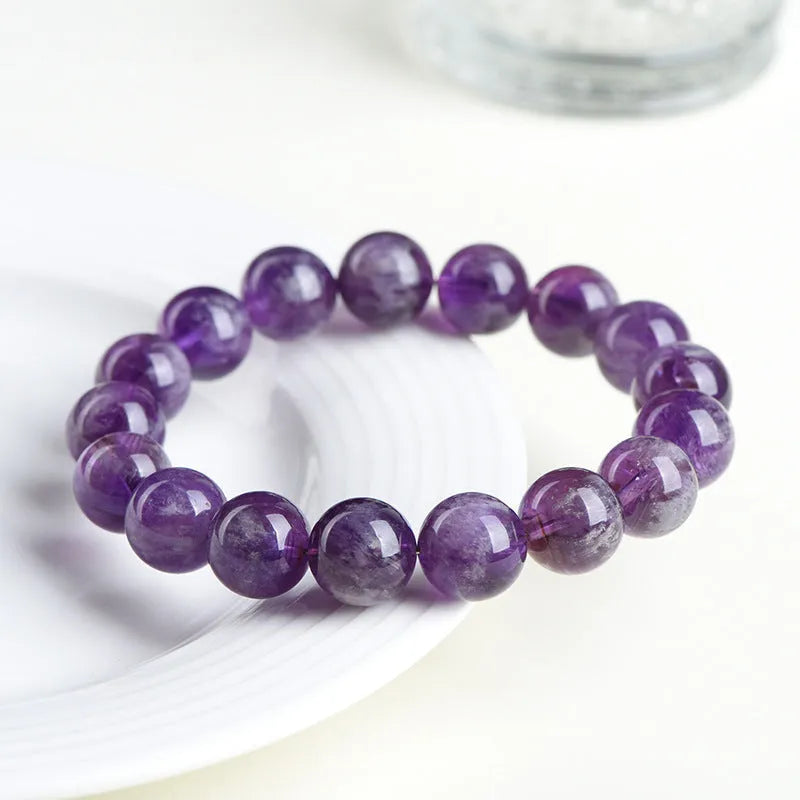 Natural feather amethyst Snow Mountain purple crystal bracelet with geometric beads and Ruyi symbol.