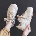 Women's low-top rubber sole sneakers in pink and white with height increase function
