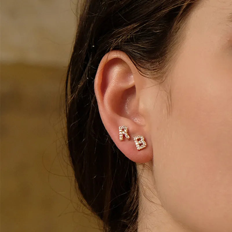 Brass gold plated alphabet letter earrings showing single English letter design with zircon stones