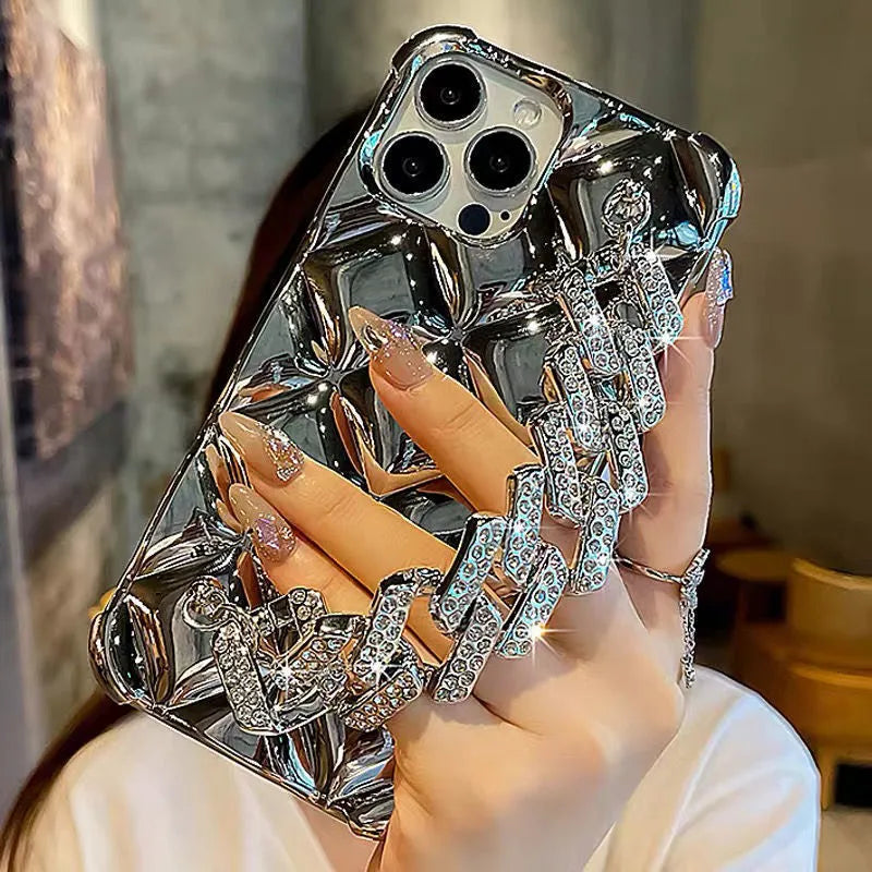 Silver diamond bracelet phone case for iPhone with chain and rhinestone lock on a TPU back.