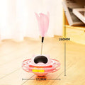Pink self-moving cat toy with turntable base measuring 17cm by 10cm