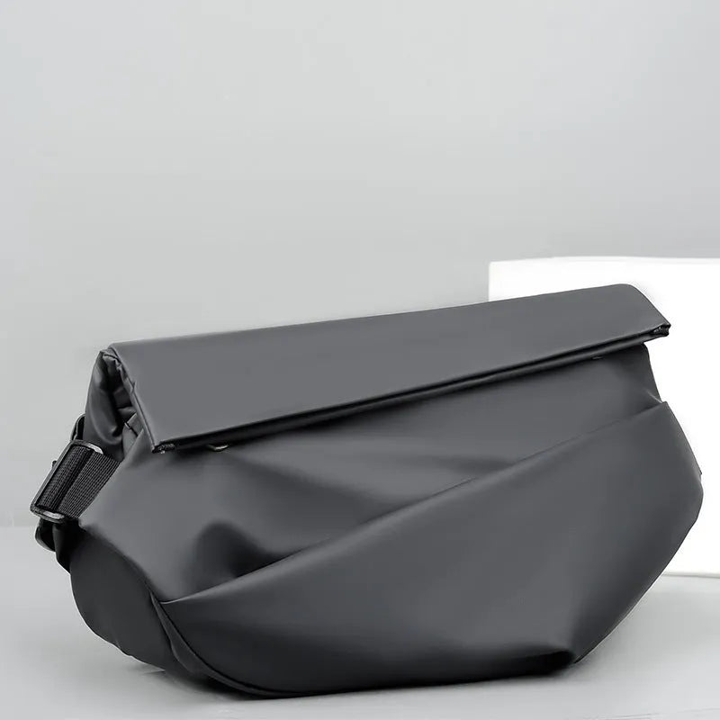 Grey PU leather crossbody sling backpack for men showing horizontal square shape and shoulder strap