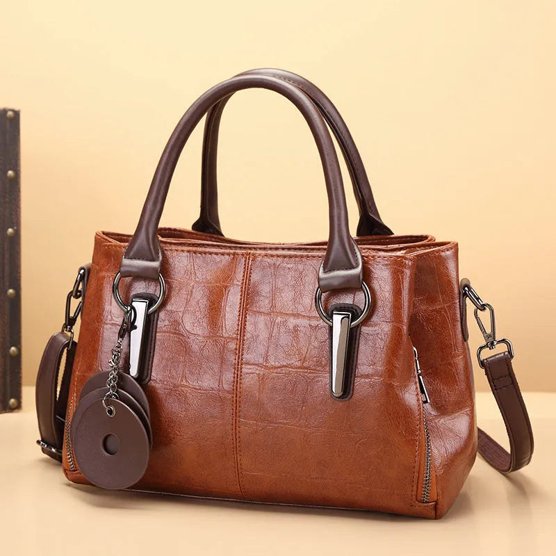 Horizontal square PU leather shoulder bag with contrasting sewing thread detail and organised interior compartments