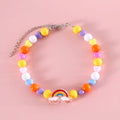 Adjustable colourful bead cat necklace in small flower, rainbow, or peach design on a white background.