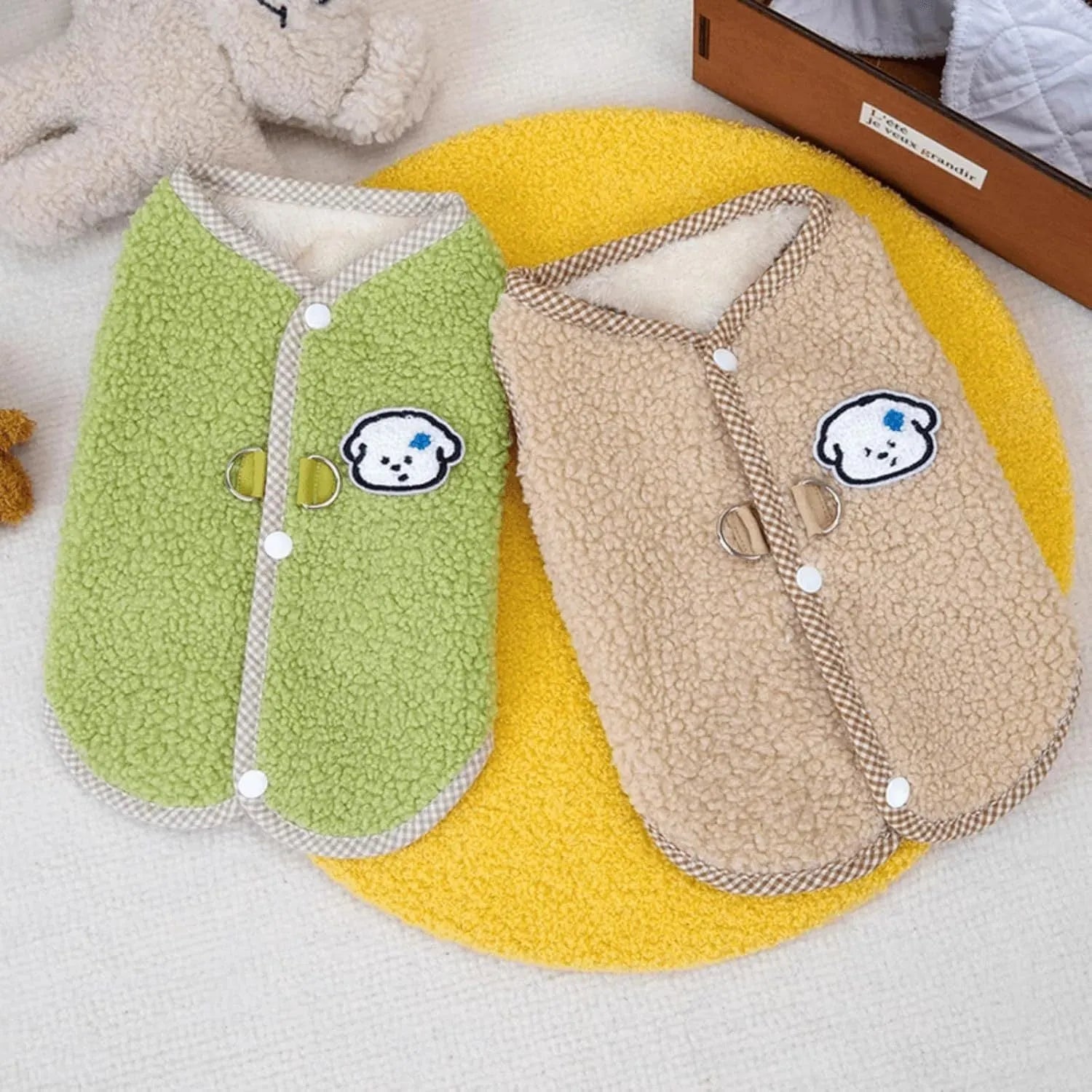 Green coral fleece dog vest with a metal leash ring on the back for a small dog.