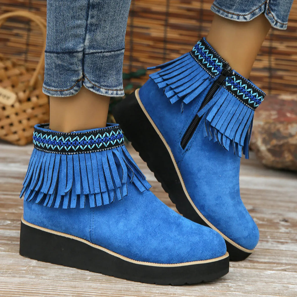 Women's black suede wedge ankle boots with side zipper and decorative tassel on a thick rubber sole.