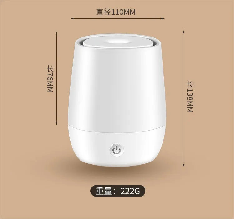 White USB aroma diffuser with simulated flame effect on a wooden surface.