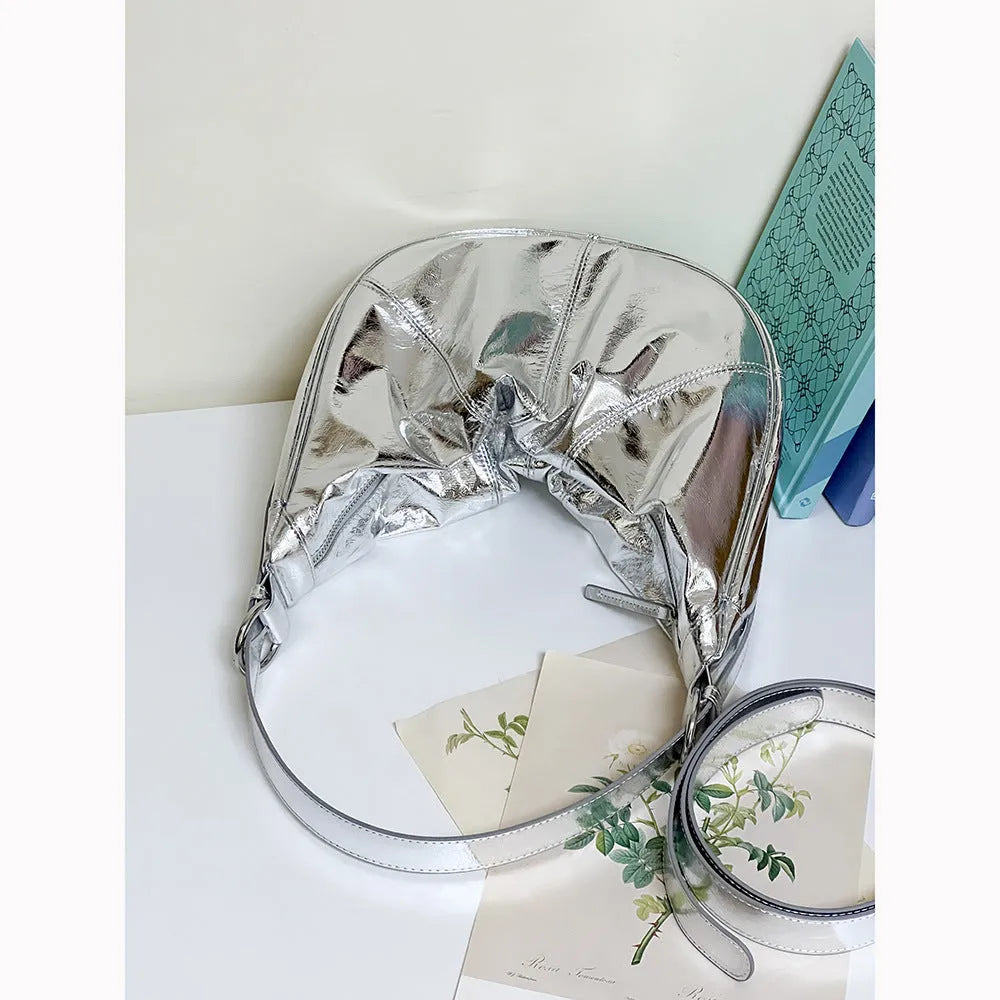Women's soft cowhide leather shoulder bag with dumpling shape showing sandwich pocket and double joint straps