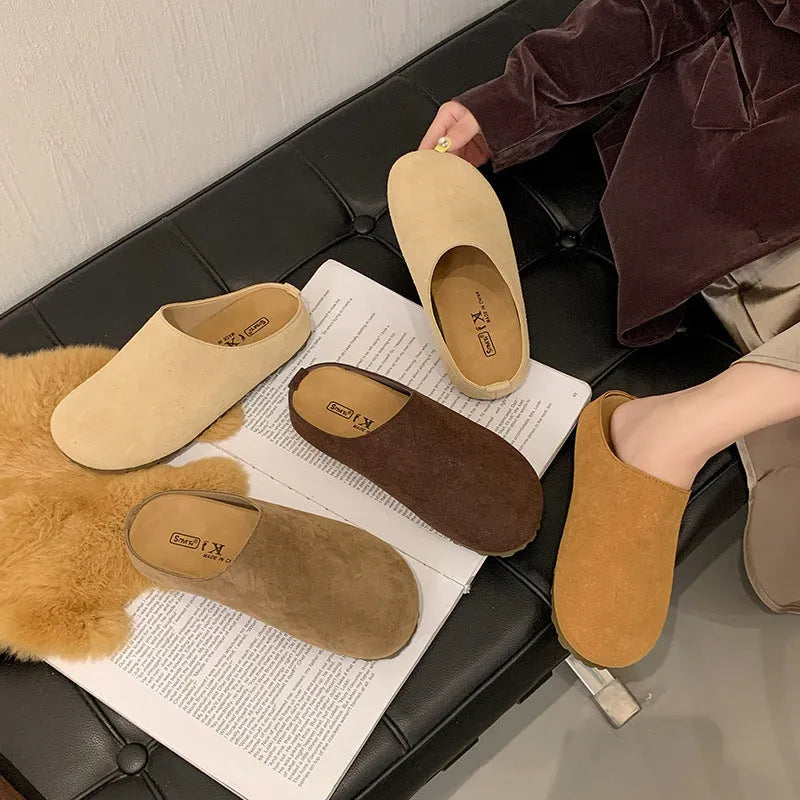 Flat outdoor slip-on slippers with square toe in apricot colour on a plain background.