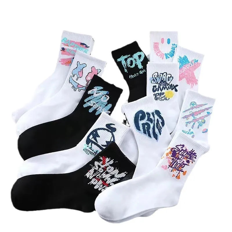 10 pairs of white cotton tube socks with graffiti pattern, middle calf length, on a plain background