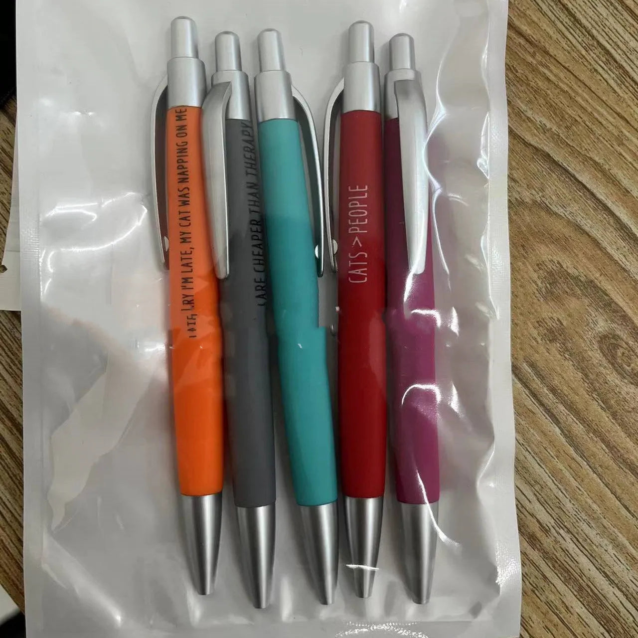 Set of five automatic pens with animal designs and a beaded carry bag for children's art projects