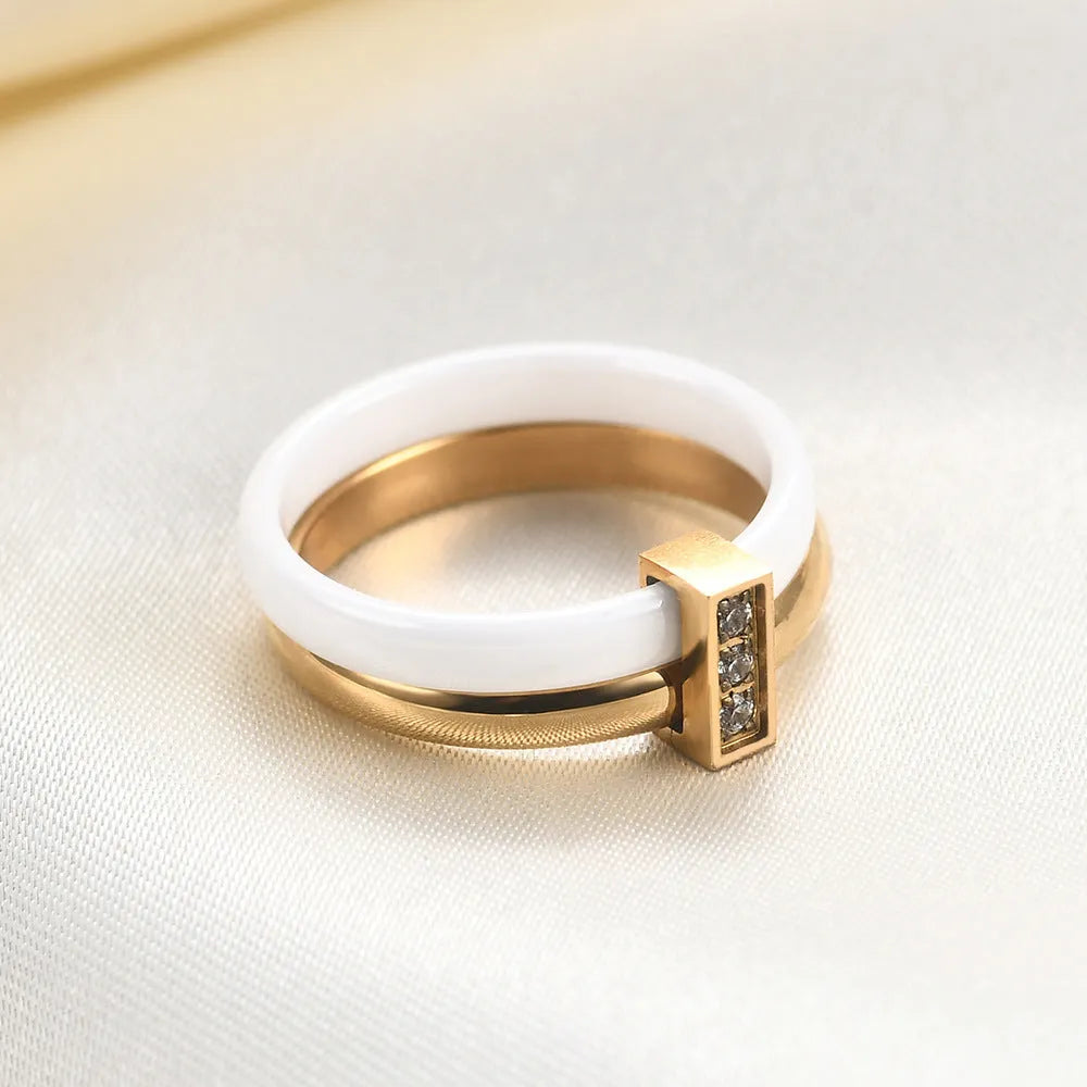 Geometric ceramic women's ring with zirconium detailing in steel black or gold white finish