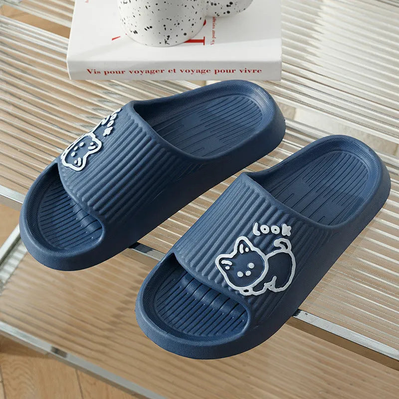 Women's green cat slippers with thick EVA platform sole on a wooden floor