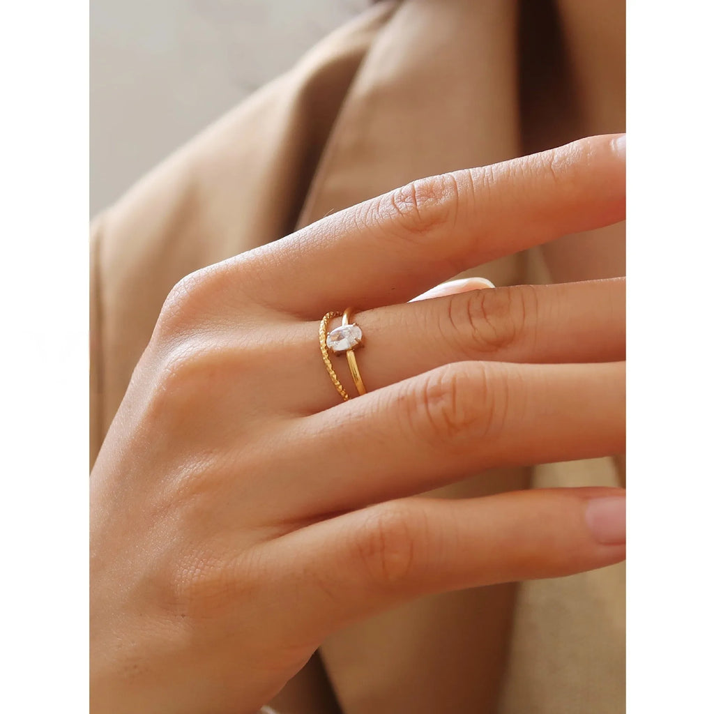 Golden stainless steel ring with either love heart or oval charm on simple band