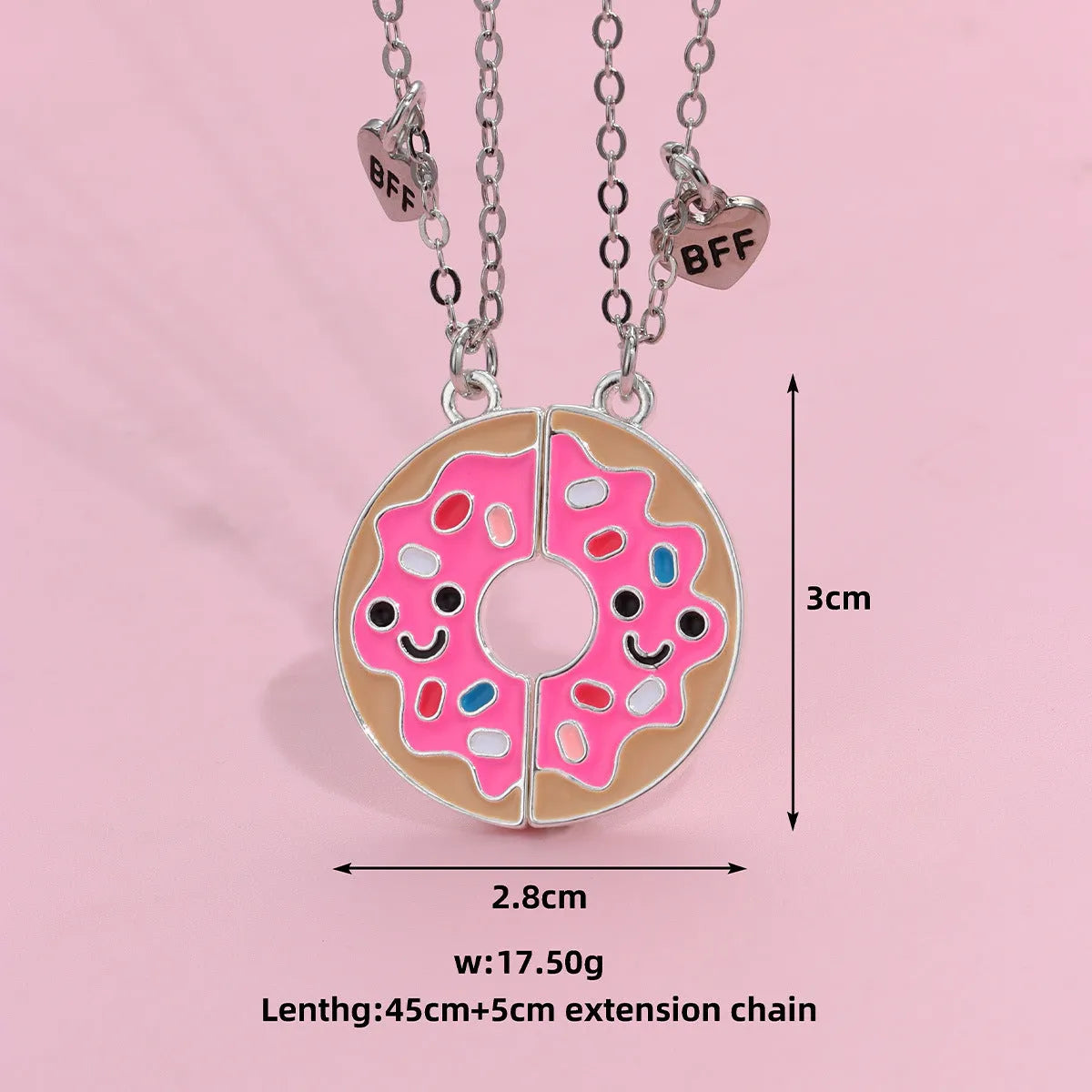 Two matching zinc alloy pendants in donut and watermelon shapes with glossy oil drip finish on cross chains