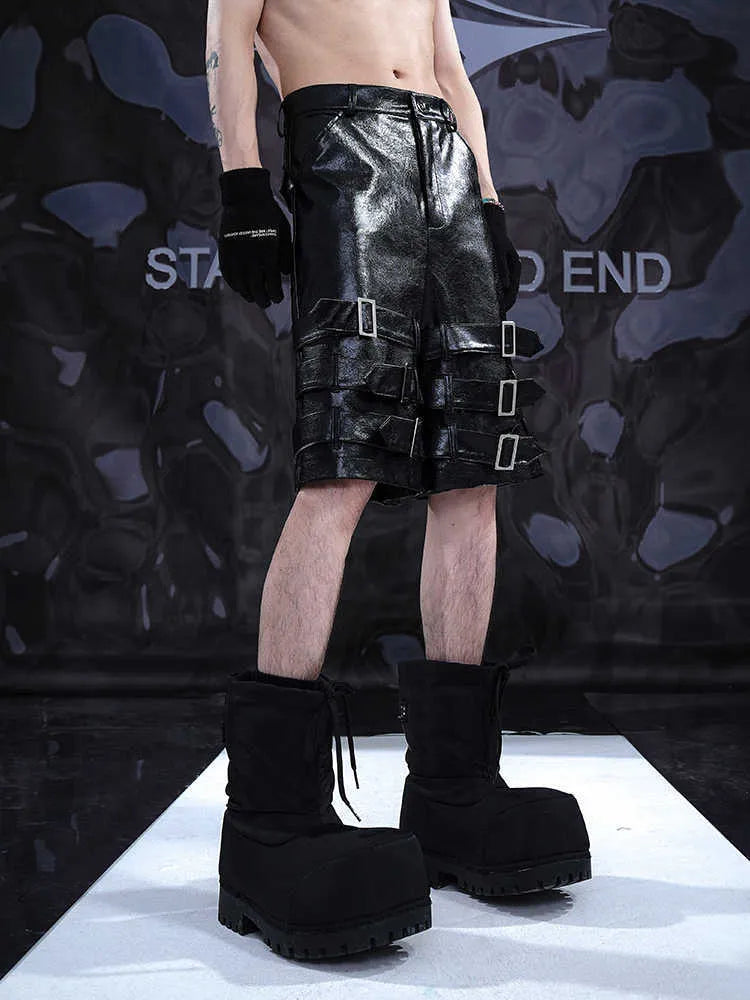 Men's black PU leather casual shorts with cropped length and mid-low waist.