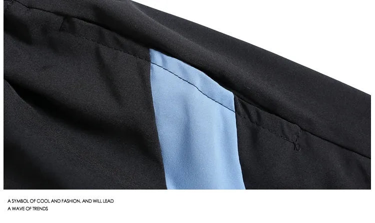 Black and grey quick-drying sports shorts with elastic waistband and loose straight-leg design