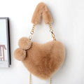 Soft plush heart-shaped women's handbag in a medium size with a removable shoulder strap.