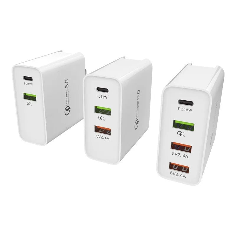 White or black fast charge charger with multiple USB ports and international plug options