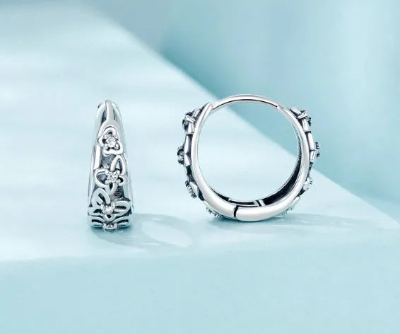 Sterling silver butterfly earrings with zircon stones and retro hollow design measuring 14mm by 5mm