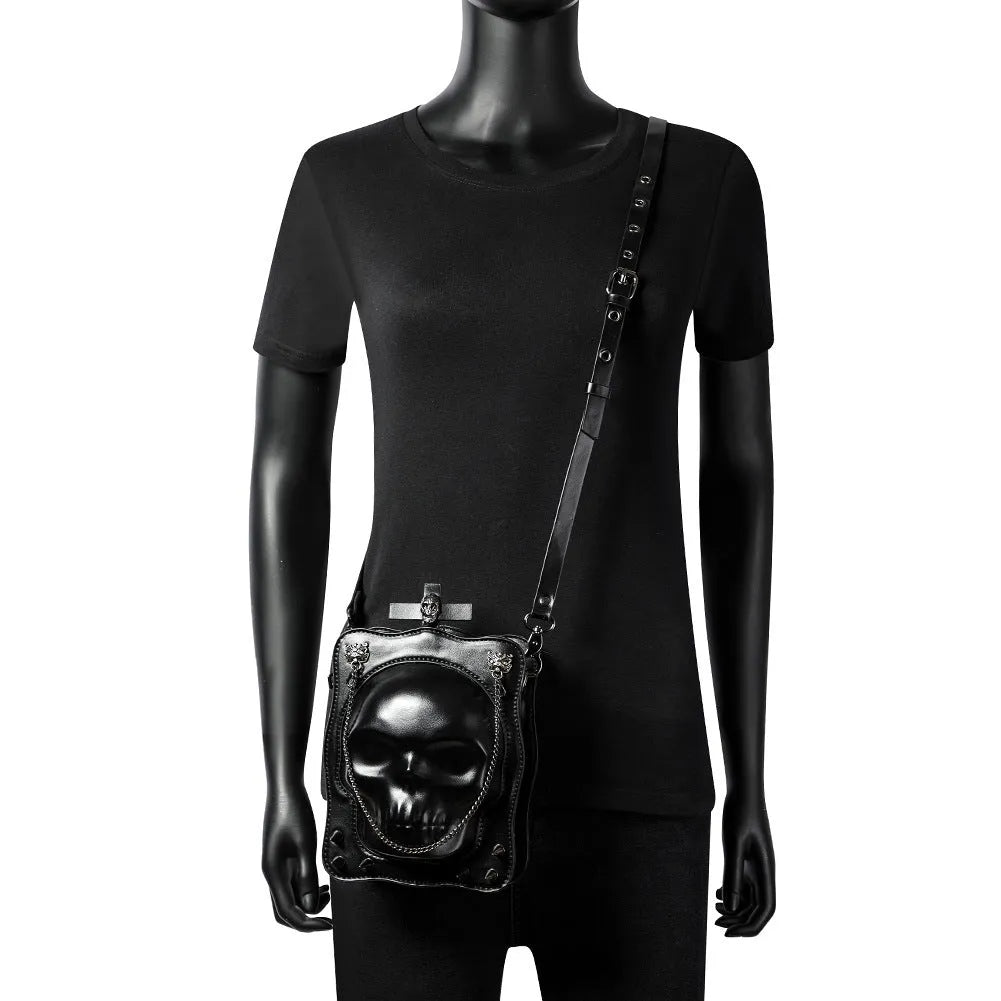 Black mini square crossbody bag with skull gothic design, stitching, rivets and chains on PU leather