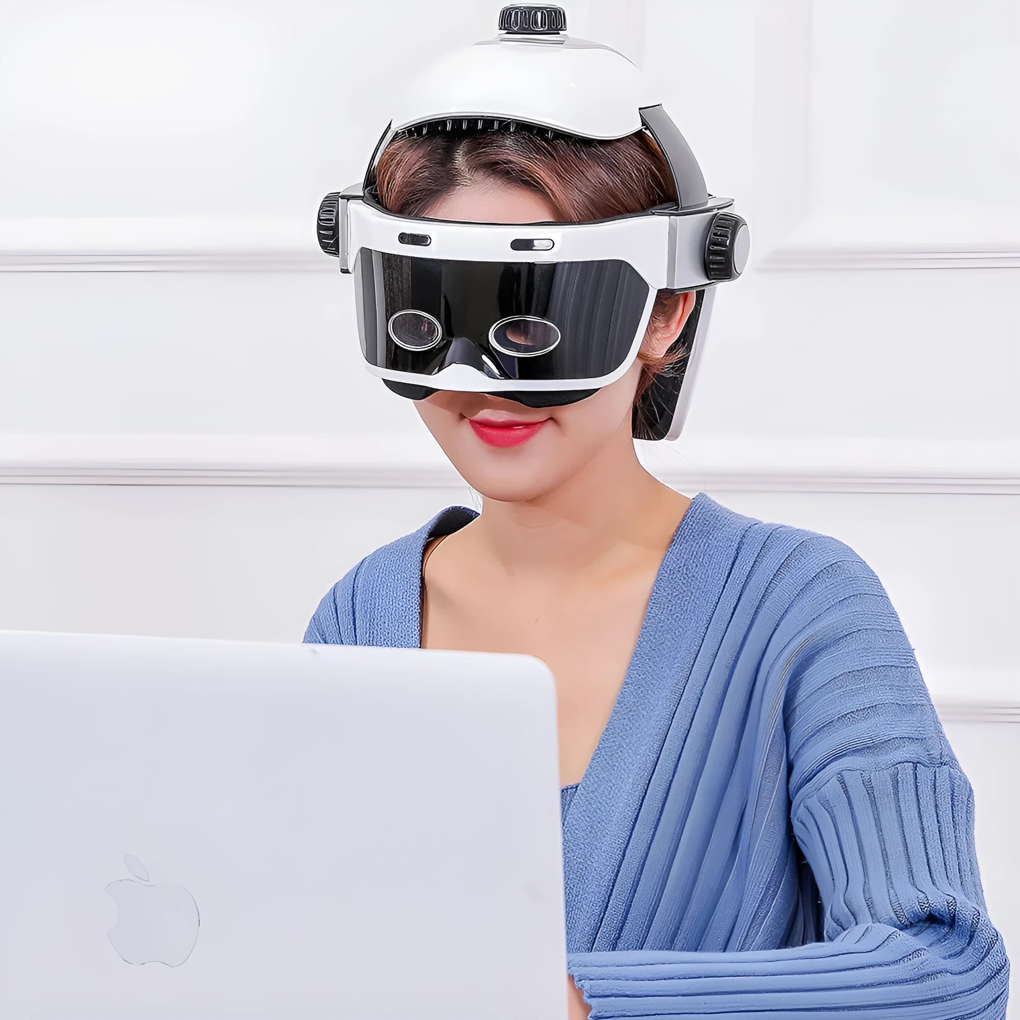 Electric eye massager in white and black with adjustable headband and LCD remote