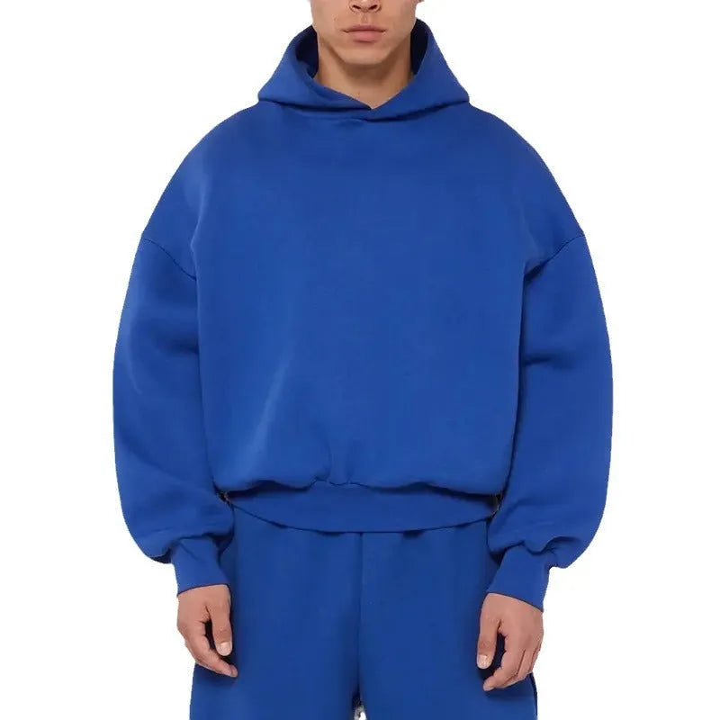 Men's grey fleece-lined pullover hoodie with wool lining shown in casual wear