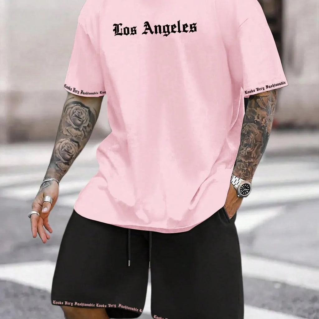 Sports style short-sleeved top and matching shorts set laid flat, showing thin polyester blend fabric.