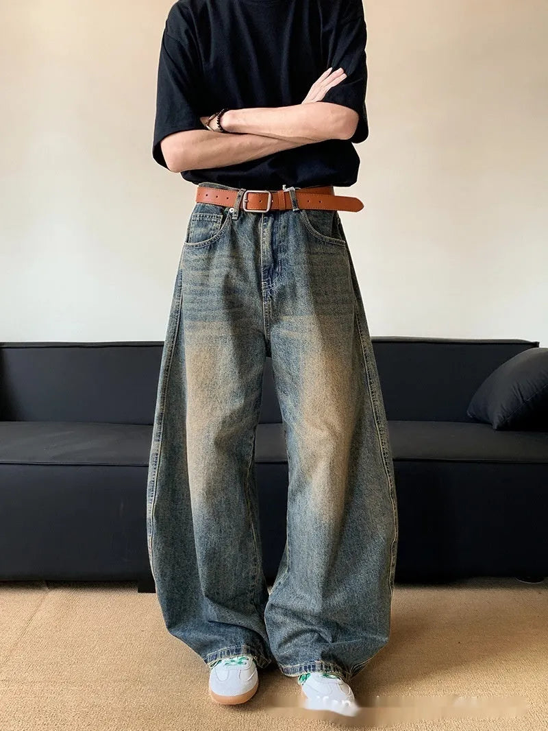 Men's retro blue distressed machete denim jeans with wide-leg silhouette and slim hip fit