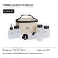 Set of six white portable seasoning bottles with black lids for outdoor picnics and camping.