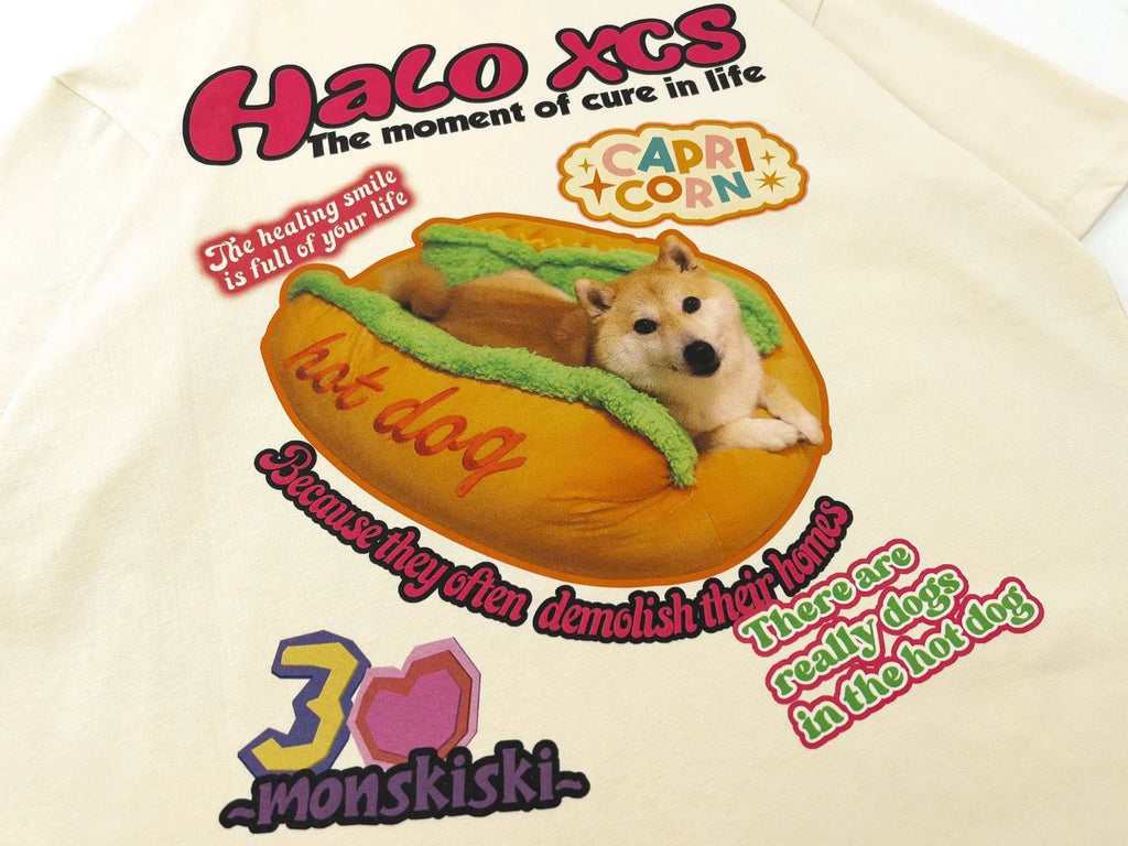 Cartoon hamburger dog printed loose-fit cotton t-shirt in apricot on a model.