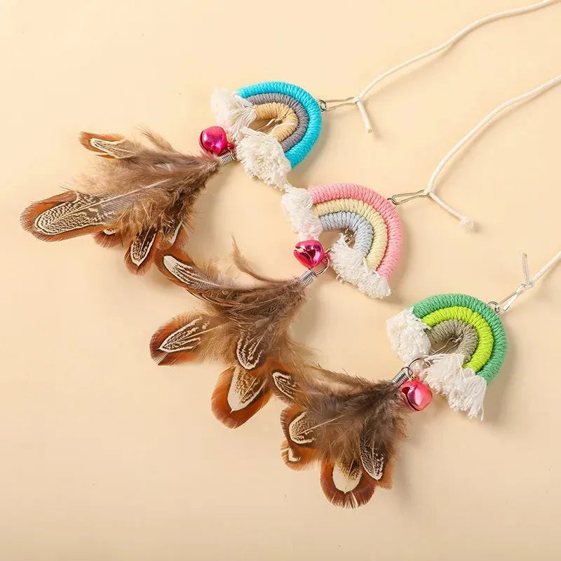 Blue feather cat toy hanging from door with elastic rope and sticky buckle clamp for interactive play