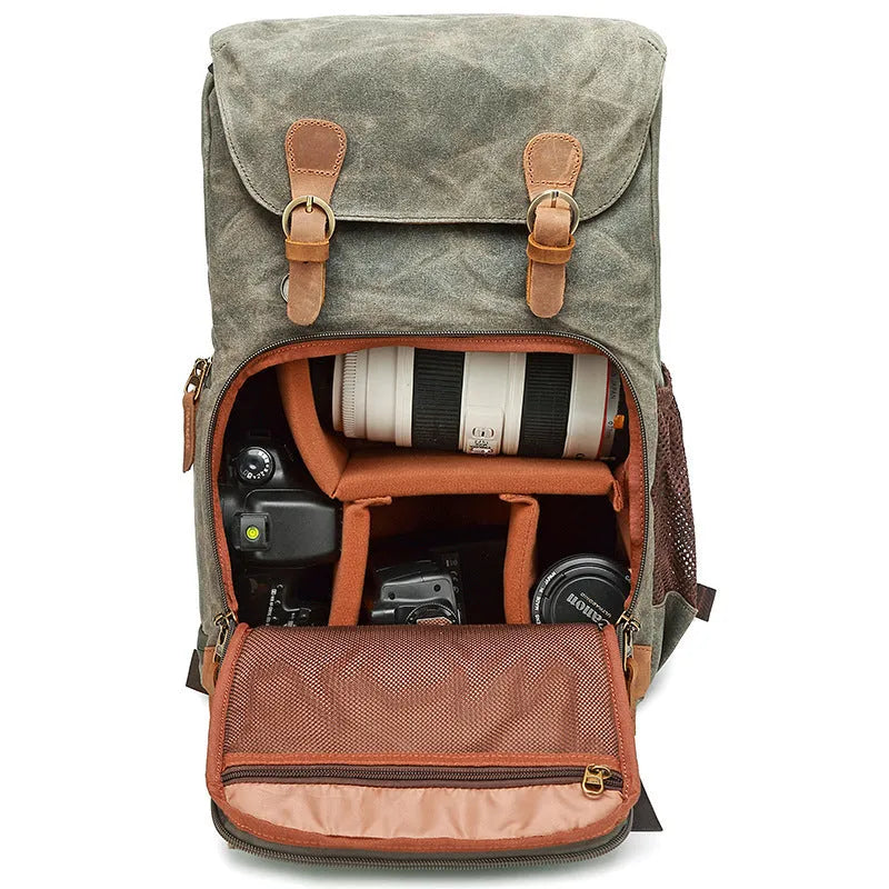 Grey black canvas backpack style DSLR camera bag with straps and zips
