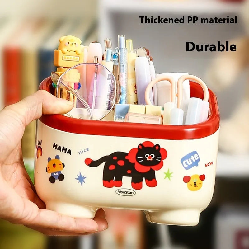 Red and brown cartoon sticker designs on a plastic desktop storage box with grid organiser compartments.