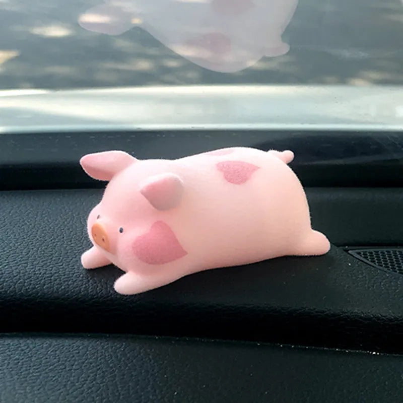 Cartoon pig character resin car ornament for dashboard or windscreen decoration.