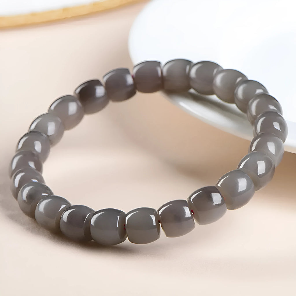Straight cut Hetian jade bracelet with smokey violet beads measuring 8x9mm