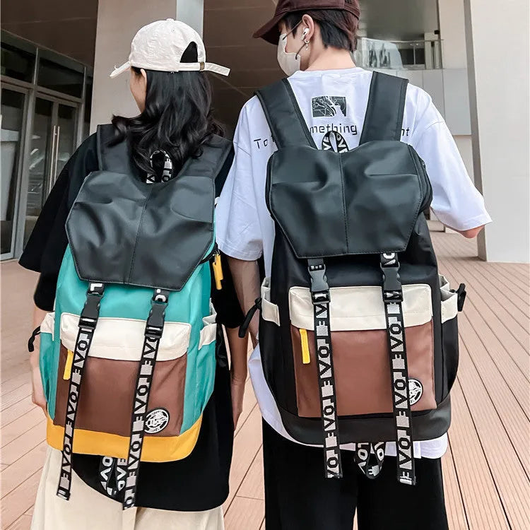 Oxford cloth school backpack showing three carrying methods with 32cm width dimensions