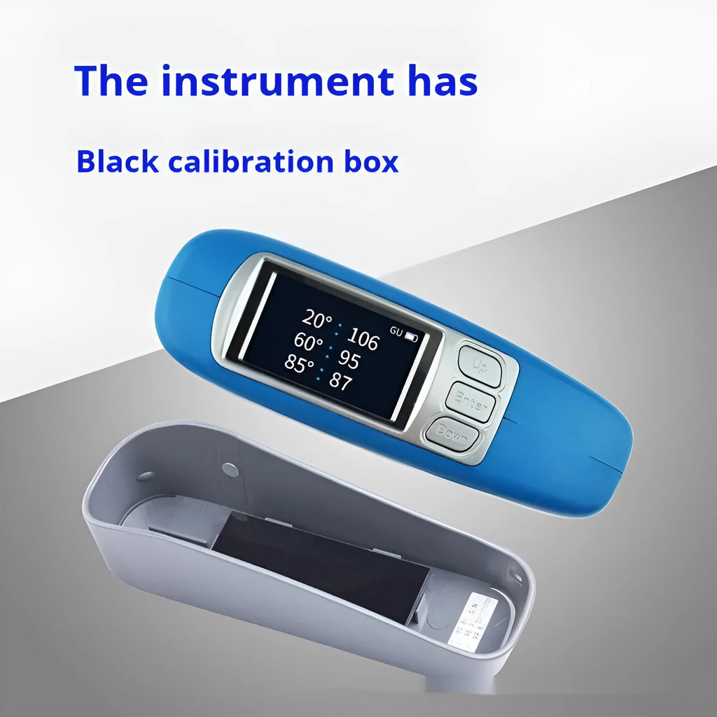 Handheld ceramic brightness stone portable glossiness tester gloss meter on a work surface.