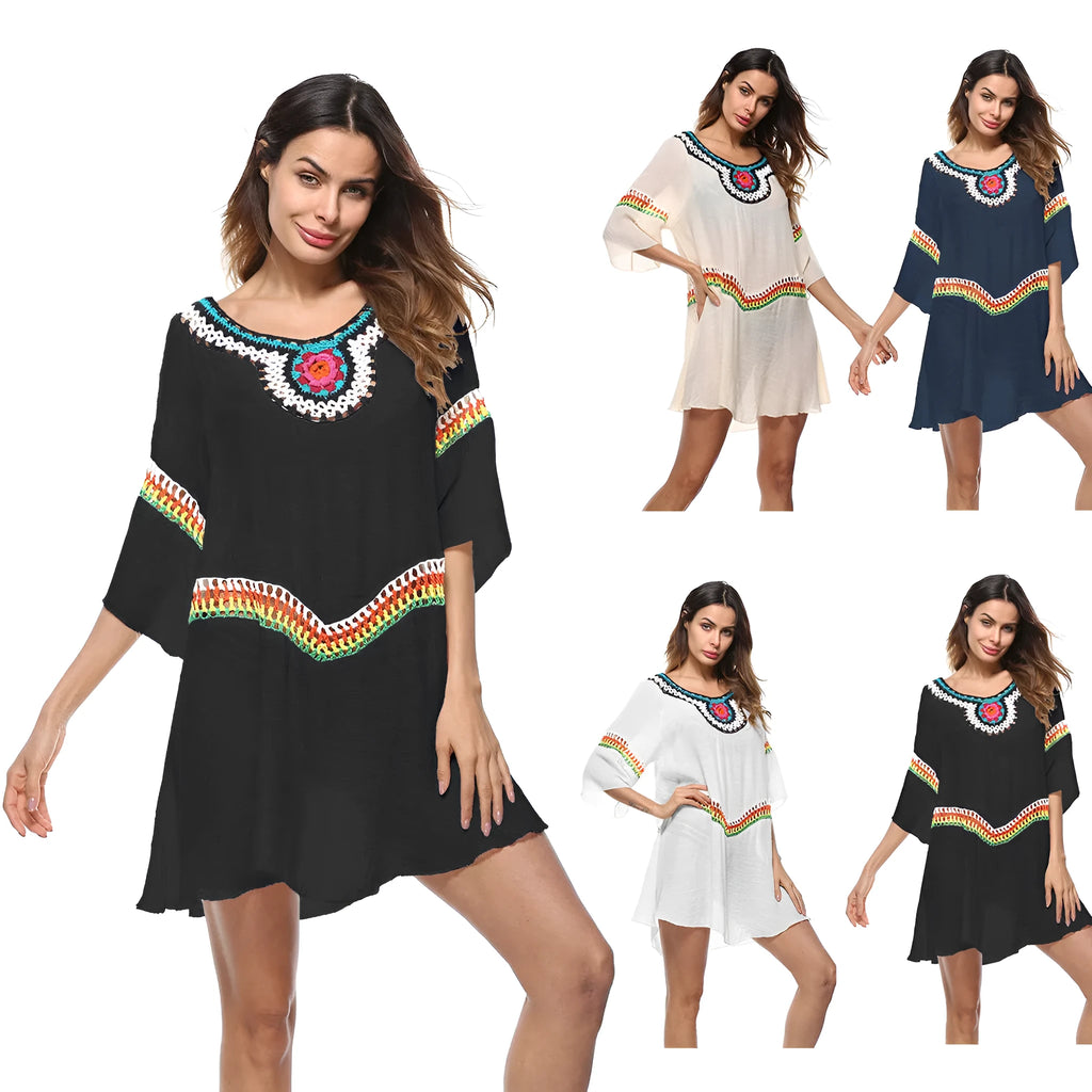 Crocheted white ethnic-style beach cover-up for women, shown as sun protection clothing.